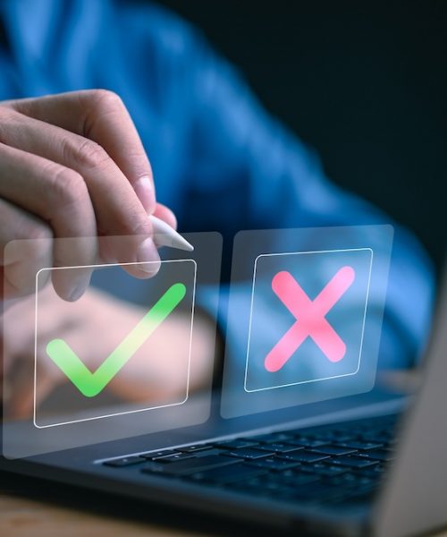 Businessman is thinking and making choices between right and wrong symbols. Decide to vote concept. Yes or No decisions, business options in difficult situations. True False, crisis decision making.